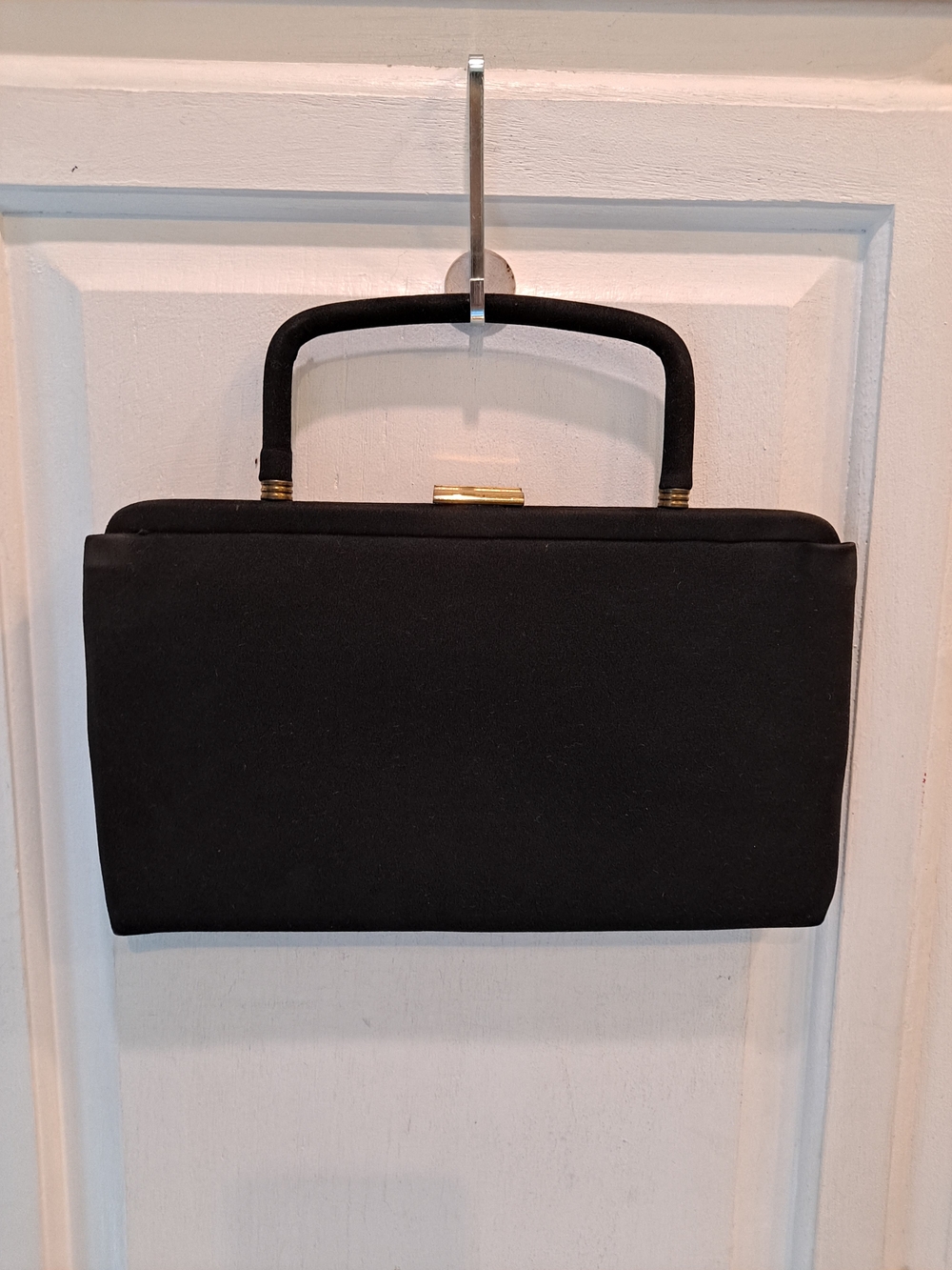 Elegant Black Mini Top-Handle Bag with Gold Accent